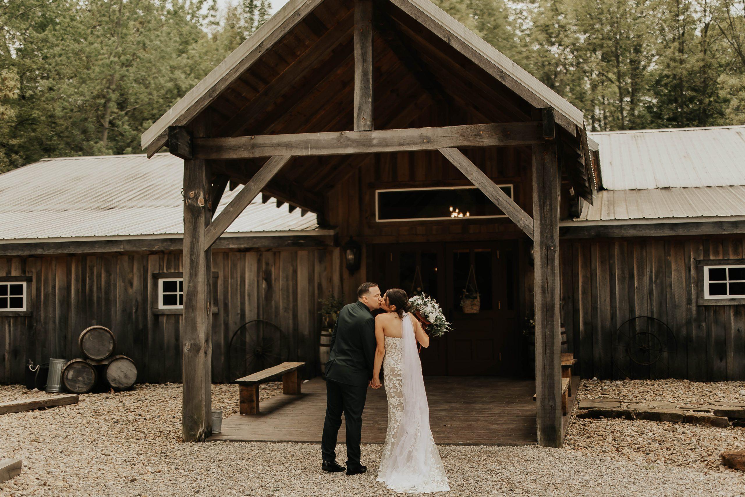 Brown County Indiana Wedding Venues-04 The Barn at Timber Ridge a Brown County Wedding Venue, with a couple in front of the Barn